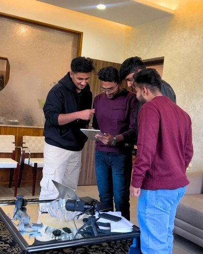 The Desi Growth Media team reviewing content together on a tablet